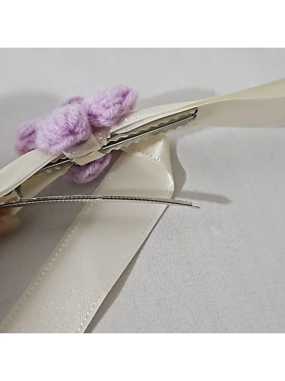 Hand Crafted Ivory Bow with Purple Crochet Flower